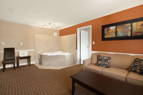 Suite, 1 King Bed | Desk, blackout drapes, iron/ironing board, free cribs/infant beds