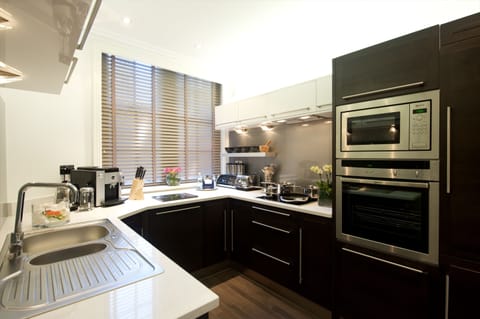 Deluxe Suite, 1 Bedroom (Minsters) | Private kitchen | Fridge, microwave, stovetop, dishwasher