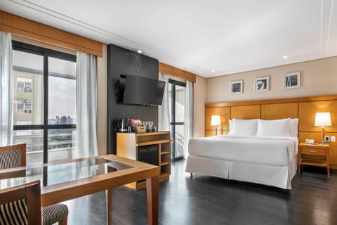 Deluxe Room, 1 King Bed, Balcony | City view