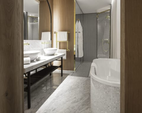 Prestige Suite | Bathroom | Designer toiletries, hair dryer, bathrobes, slippers