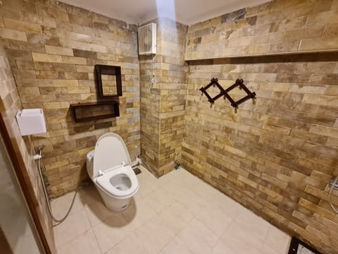 Family Room, 2 Bedrooms | Bathroom | Combined shower/tub, rainfall showerhead, free toiletries, hair dryer