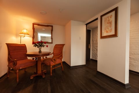 Suite, 1 Bedroom, Balcony | Living area | TV