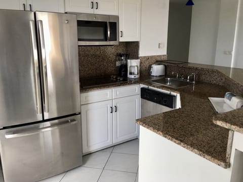 Deluxe Suite, 1 Bedroom, Ocean View | Private kitchen | Fridge, microwave, stovetop, dishwasher