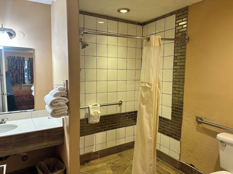 Room, 1 King Bed, Accessible, Non Smoking | Bathroom | Combined shower/tub, deep soaking tub, free toiletries, towels