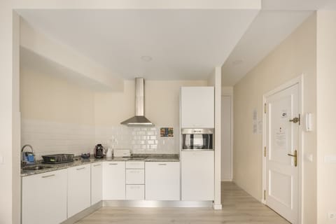 City Apartment, 1 Bedroom, City View | Laptop workspace, iron/ironing board, free cribs/infant beds