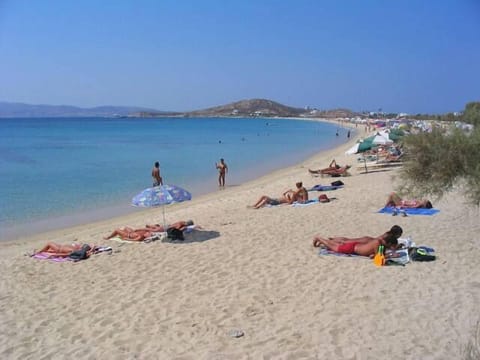 Beach nearby, white sand, beach towels