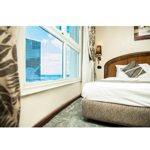 Deluxe Room (with Sea Side View) | In-room safe, desk, blackout drapes, free cribs/infant beds