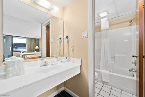 Standard Room, 2 Queen Beds | Bathroom | Combined shower/tub, hair dryer, towels