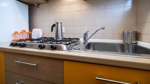 Family Studio (0 Bedroom) | Private kitchen | Microwave, oven, dining tables