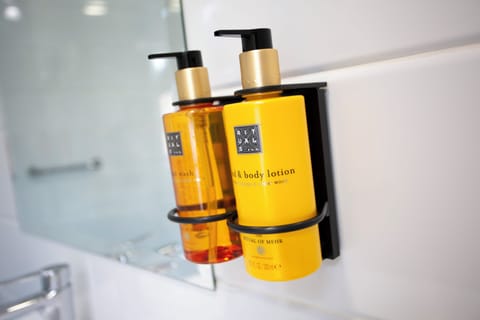 Designer toiletries, hair dryer, towels, soap