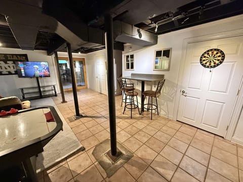 Basement Hangout Room- Tv- Air hockey table- Bar top card table- Half bathroom