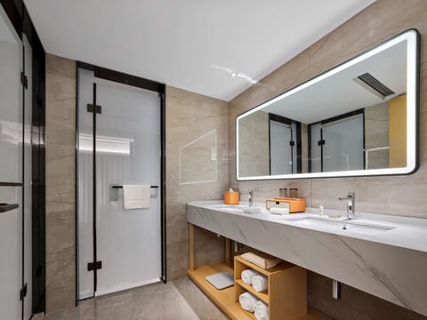 Suite, 1 Bedroom | Bathroom | Rainfall showerhead, free toiletries, hair dryer, slippers