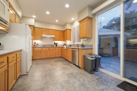 This fully-equipped kitchen has everything you need. You can see into the living room and dinning area while cooking.