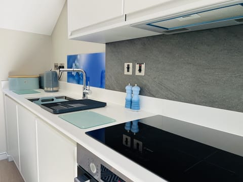 Well equipped kitchen with an abundance of natural light.