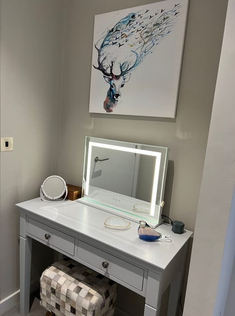 Dressing table and stool situated within the bedroom