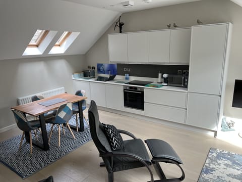 View from the living room to the dining/kitchen area.
