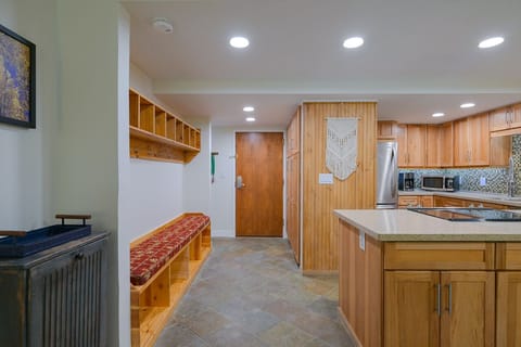 Entry, storage, kitchen. New lighting, higher ceilings!