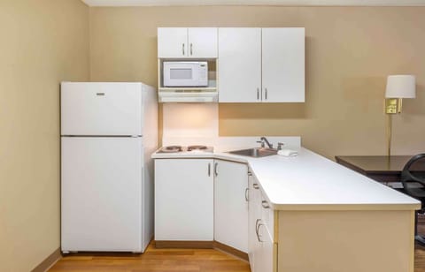 Studio, 1 Queen Bed, Non Smoking | Private kitchen | Full-size fridge, microwave, stovetop