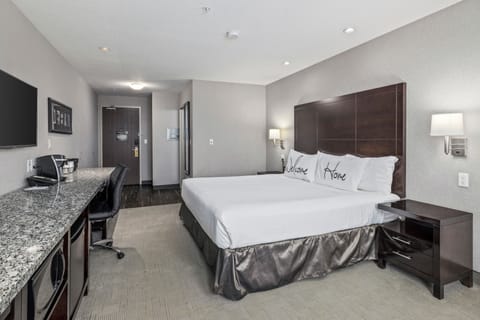 King Room | Premium bedding, desk, laptop workspace, blackout drapes