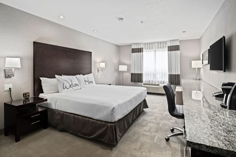 King Room | Premium bedding, desk, laptop workspace, blackout drapes