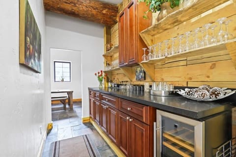 The butler’s pantry features a stemware for serving, and additional cabinet and counter space for meal prep.