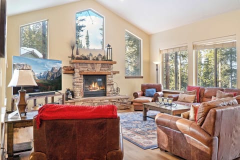 Gather with your group in the stately living room space where you will find plush furnishings, soaring windows, and a striking stone fireplace.