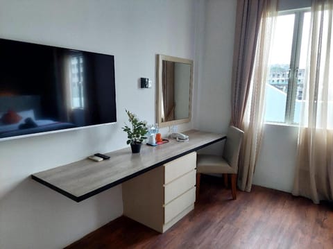 The Sakura Penthouse | Living area | 32-inch LCD TV with cable channels