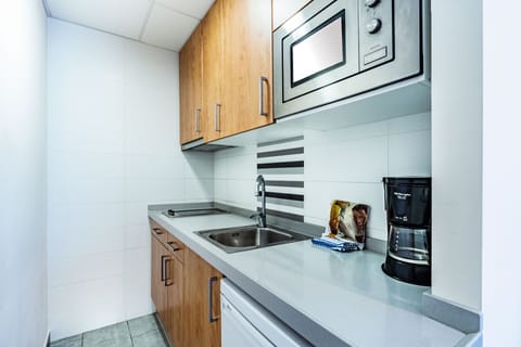 Standard Apartment | Private kitchen | Full-size fridge, microwave, stovetop, cookware/dishes/utensils