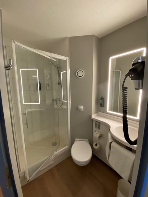 Shower, eco-friendly toiletries, hair dryer, towels