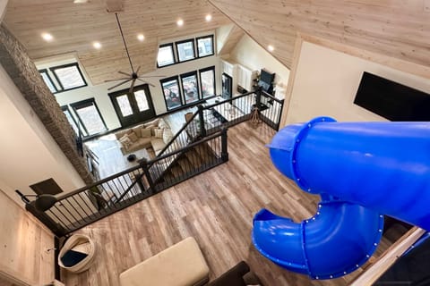 Why take the stairs when you can zip down a spiral slide into the living room? Fun for kids and kids-at-heart!