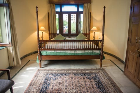 Deluxe Room (with AC) | Minibar, in-room safe, desk, iron/ironing board