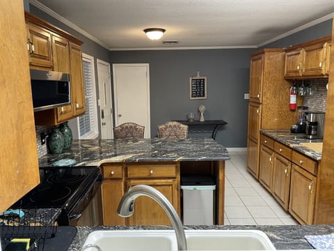Kitchen has granite counters.