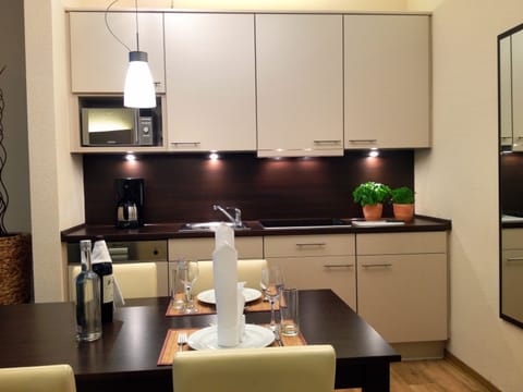 Apartment, 1 Bedroom | Private kitchen | Fridge, electric kettle, toaster, eco-friendly cleaning products