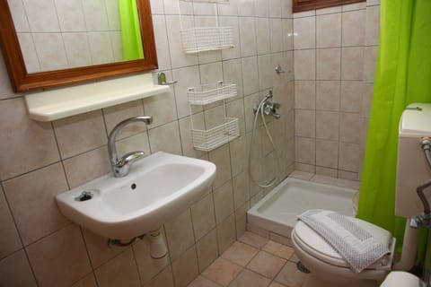 Apartment, 1 Bedroom, Garden View | Bathroom | Shower, hair dryer, towels