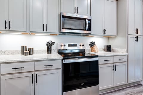 Fully stocked kitchen with modern appliances and all the tools to cook with ease