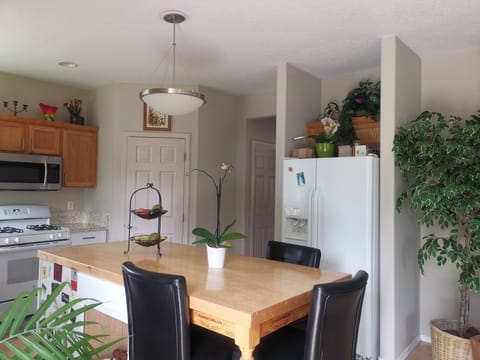 The kitchen has granite countertop and pantry room.