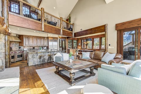 Spacious and Inviting Living Area: The main living area features oversized seating perfect for gatherings or quiet evenings by the fireplace.