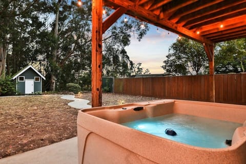 Sip a glass of wine while relaxing in our hot tub