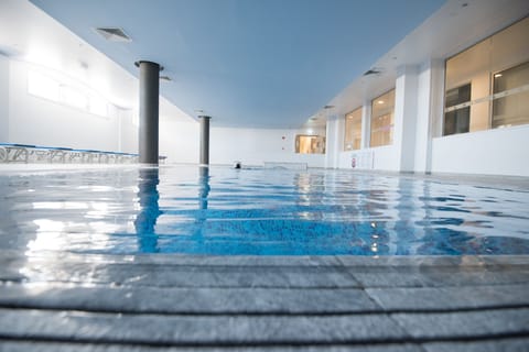 Indoor pool, seasonal outdoor pool, pool umbrellas, sun loungers