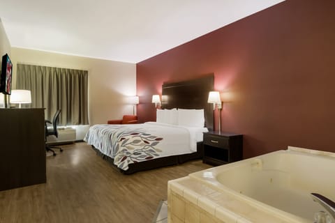 Suite, 1 King Bed, Non Smoking, Jetted Tub | Blackout drapes, iron/ironing board, free cribs/infant beds, free WiFi