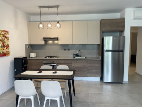 Comfort Apartment | Private kitchen | Full-size fridge, oven, stovetop, toaster