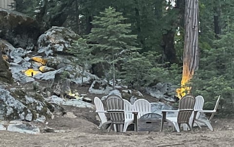 Gather around the wood firepit out back surrounded by mountain beauty