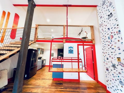 Authentic ski lift chair hanging from the ceiling.  Feel free to relax on it. 