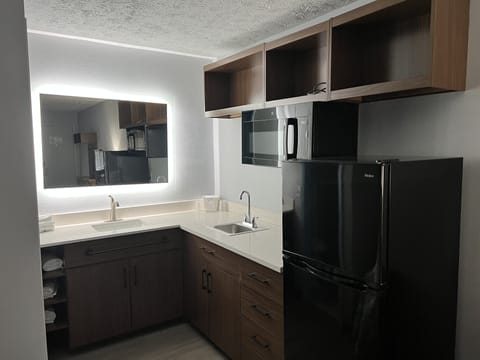 Full-size fridge, microwave, dining tables