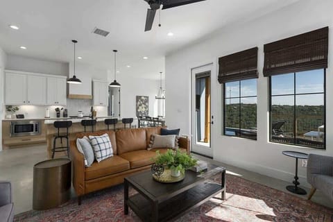 Unwind in the living room with a cozy TV setup for your enjoyment.
