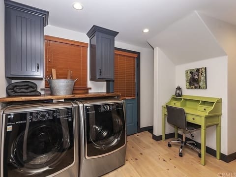 Washer/dryer and work area. Door leads out to the hot tub.