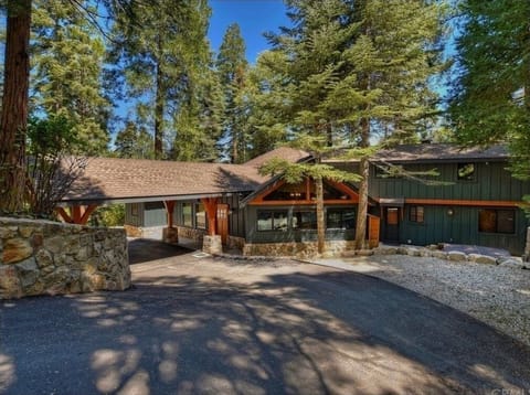Front of the house coming down the large circular driveway.
