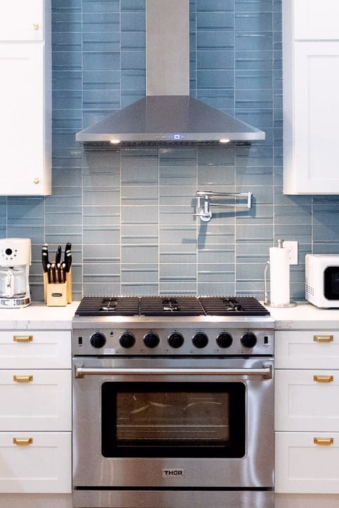 6 burner THOR gas stove/oven, pot filler faucet, designer appliances in the kitchen!