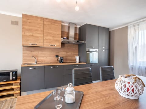 Cabinetry, Countertop, Furniture, Property, Kitchen, Wood, Curtain, Kitchen Sink, Interior Design, Table