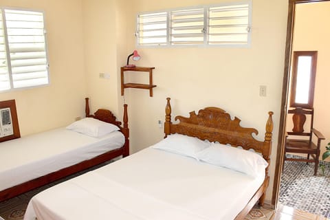 Deluxe Triple Room | Minibar, in-room safe, individually decorated, individually furnished